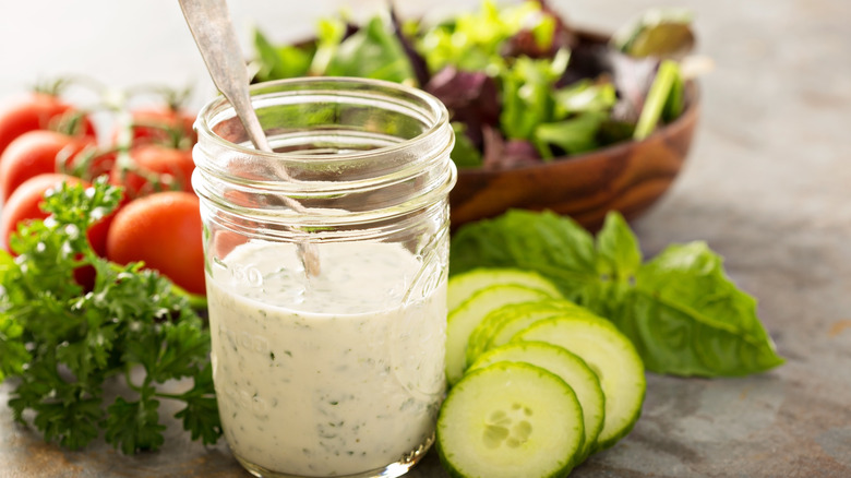 Salad ingredients and a jar of ranch dressing