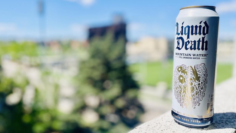 Can of Liquid Death water on outdoor ledge