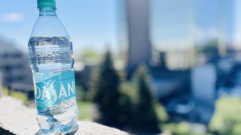 Bottle of Dasani on outdoor ledge