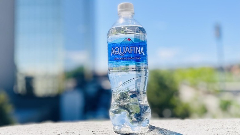 Bottle of Aquafina on outdoor ledge