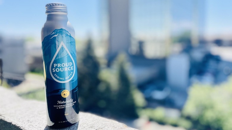 Can of Proud Source water on outdoor ledge