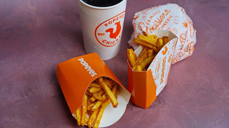 Popeyes fries, chicken burger, and a drink
