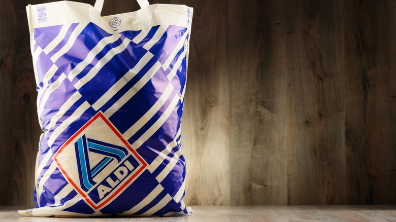 Aldi shopping bag on wooden table