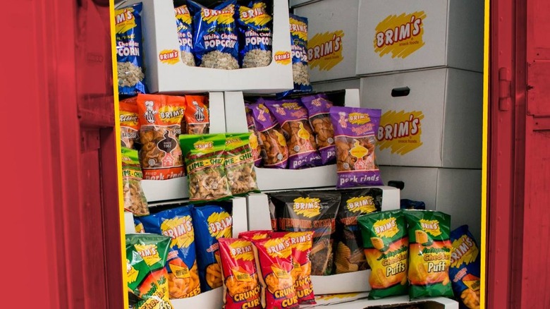 Various types of Brim's snack foods sit in boxes in a shipping vehicle