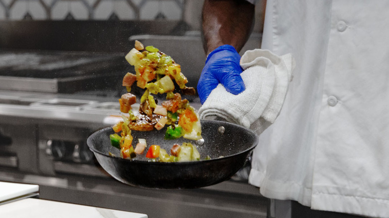 A chef at Embassy Suites prepares an omelet