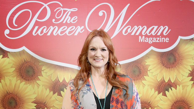 Ree Drummond smiling against sunflower backdrop