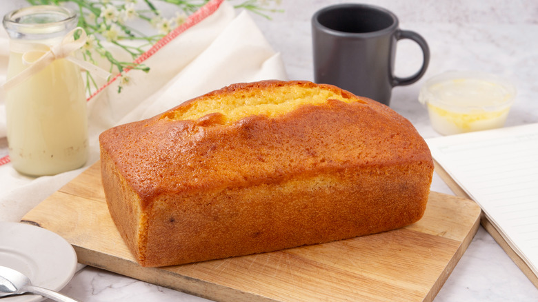 Whole pound cake on cutting board
