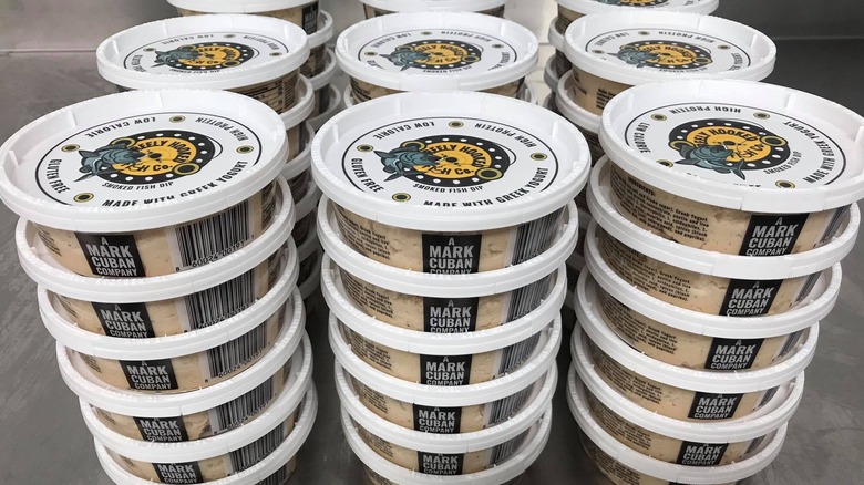 Containers of Reely Hooked Fish Company fish dip