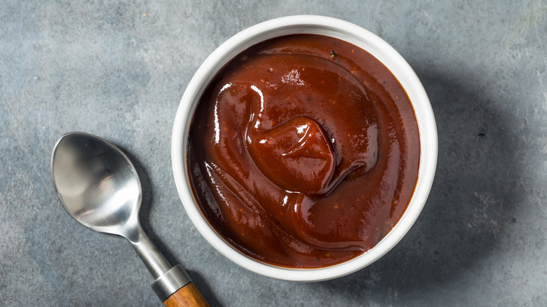 BBQ sauce in ramekin beside spoon