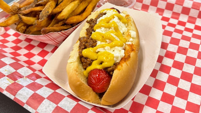 Slaw dog with fries on the side
