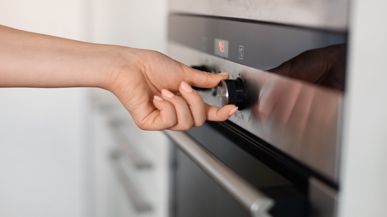 woman programming her oven