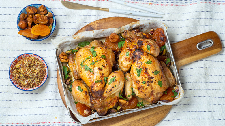 Two roast chickens with sides