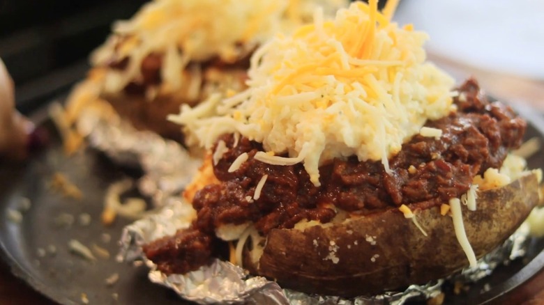 Baked potato with sloppy joe mixture and cheese