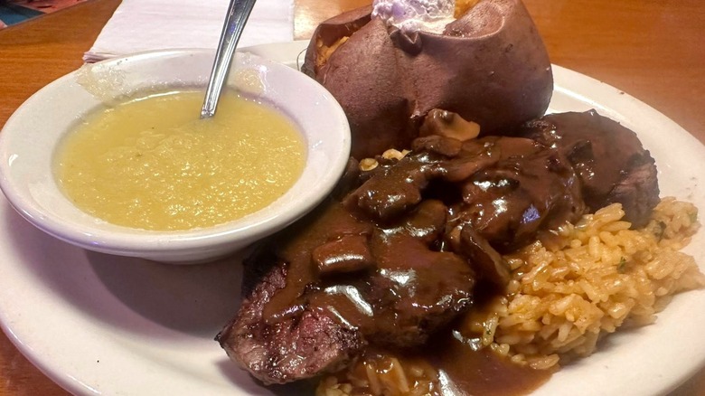 Texas Roadhouse steak with portobello mushroom sauce and sides