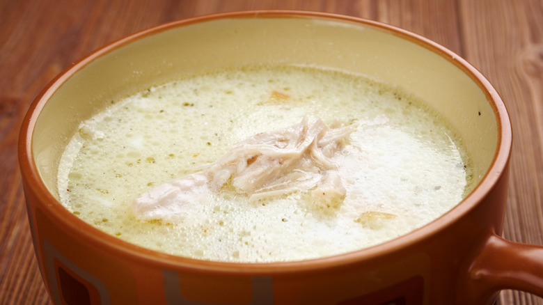 Chicken mull served in a large mug