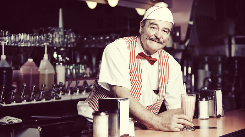 Man working at a sode fountain