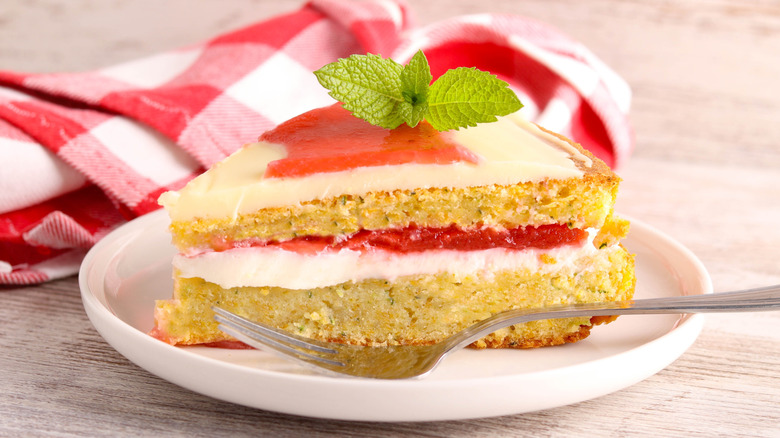 Watermelon cake slice with basil garnish