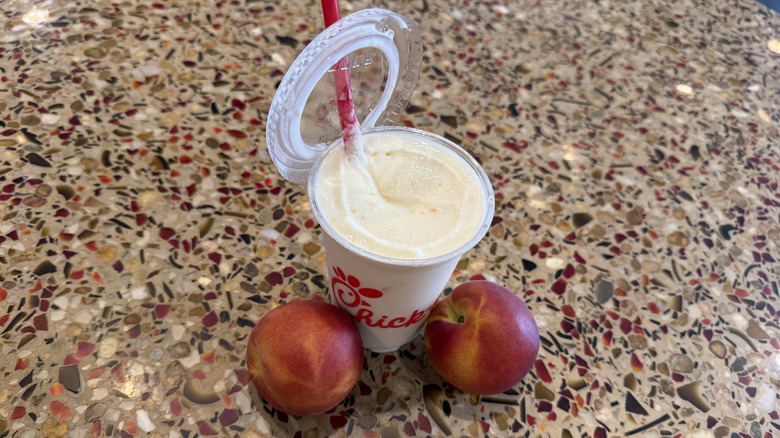 Peach Frosted Lemonade with its lid popped off