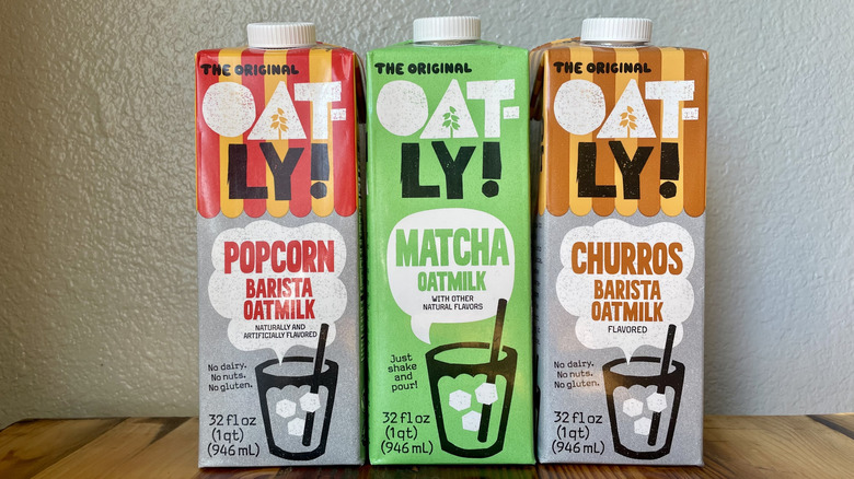 Three cartons of Oatly Oat Milk in three new flavors