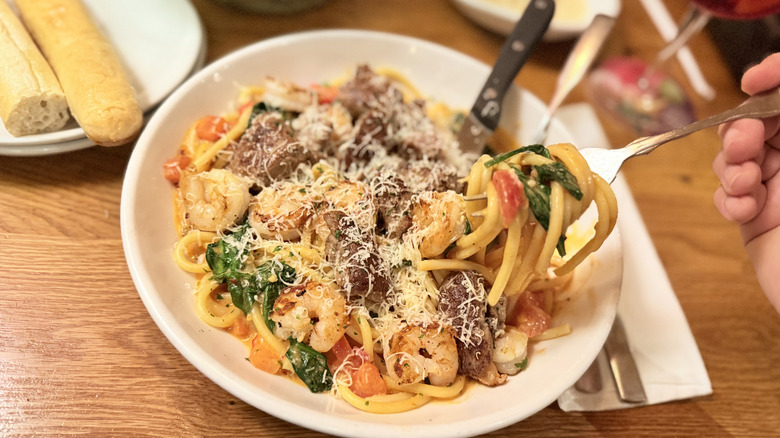 Pasta dish with noodles wrapped on fork