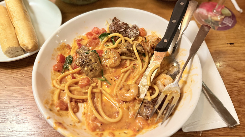 Mostly empty plate of pasta