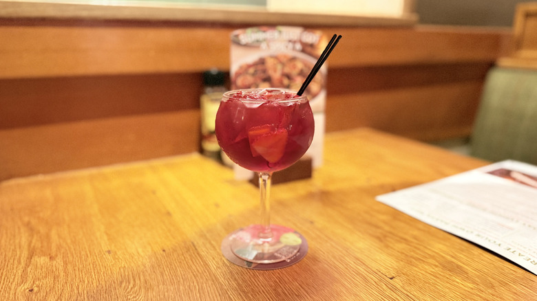 Glass of berry sangria at table