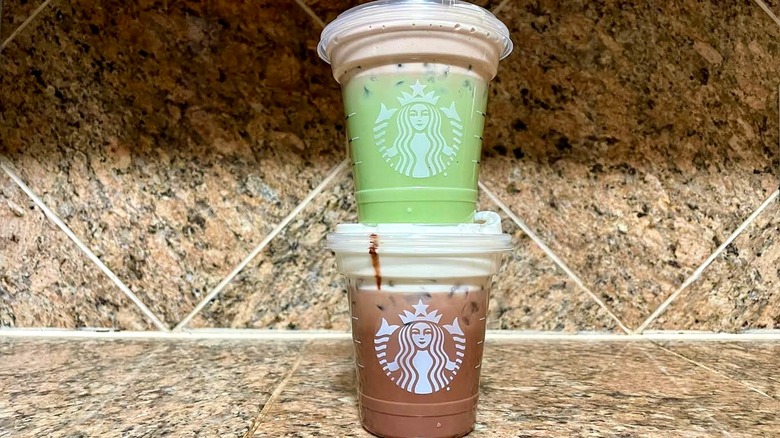 Starbucks new iced Dubai Chocolate drinks stacked on a marble counter
