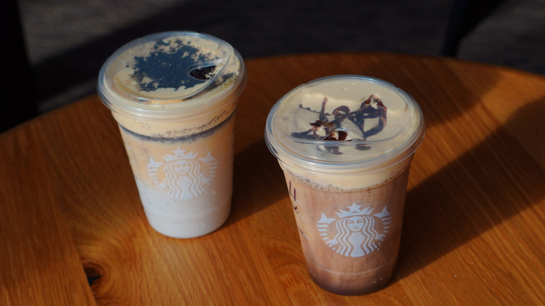 Bird's eye view of Starbucks' Snoopy Cookie Frappuccino and Charlie Brown Mocha Frappuccino (left to right).