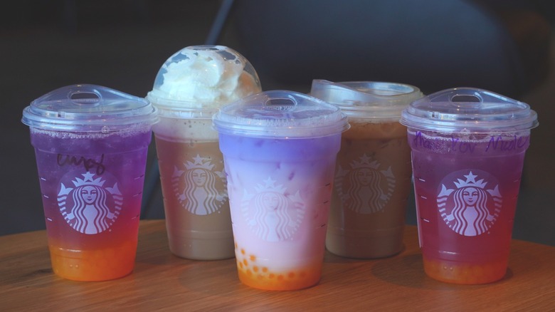 Starbucks' Tropical Butterfly Refresher, Horchata Frappuccino, Butterfly Drink, Iced Horchata Shaken Espresso, and Tropical Butterfly Lemonade Refresher (left to right).