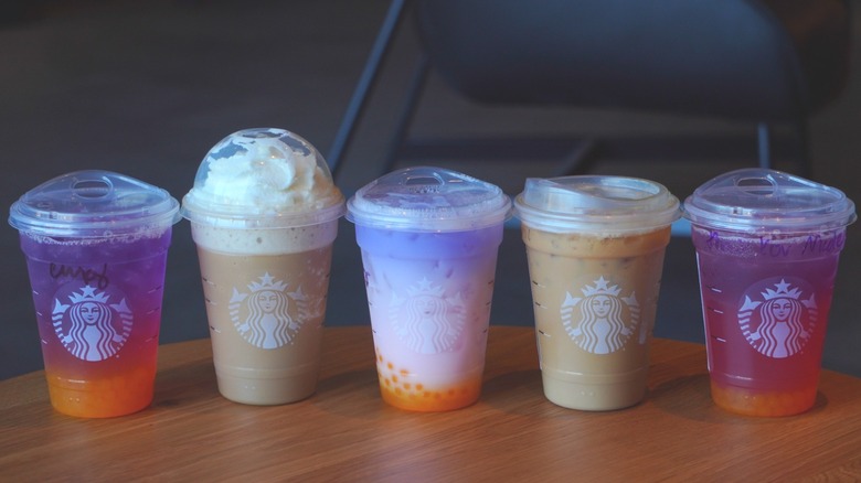 Starbucks' Tropical Butterfly Refresher, Horchata Frappuccino, Butterfly Drink, Iced Horchata Shaken Espresso, and Tropical Butterfly Lemonade Refresher (left to right).