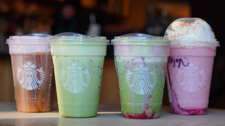 Starbucks White Chocolate Strawberry Cream Cold Brew, Iced Banana Bread Matcha, Iced Double Berry Matcha, and Strawberry Shortcake Frappuccino (left to right)