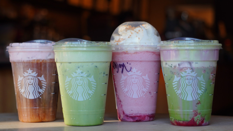 Starbucks White Chocolate Strawberry Cream Cold Brew, Iced Banana Bread Matcha, Strawberry Shortcake Frappuccino, and Iced Double Berry Matcha (left to right)