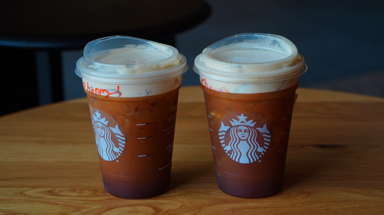Side view of Starbucks' Caramel Aerocano and Aerocano (left to right).