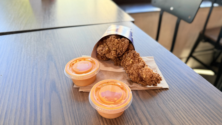 Crispy Chicken Strips with sauce on the table