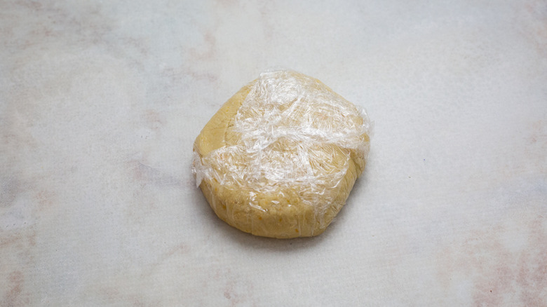 wrapped dough ball on counter