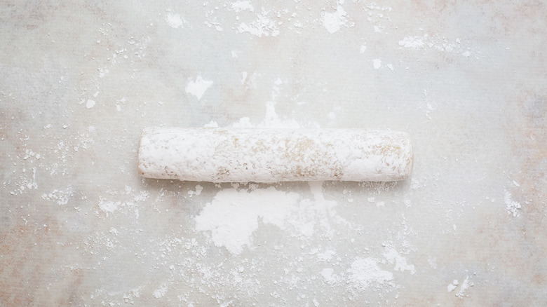 dough log on marble table