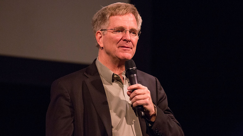 Rick Steves photographed speaking into microphone