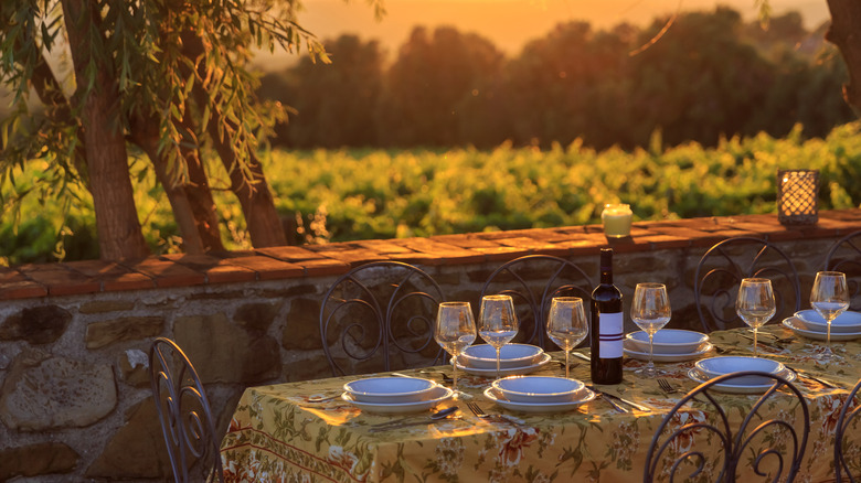 Outdoor table with vineyard background in Tuscany