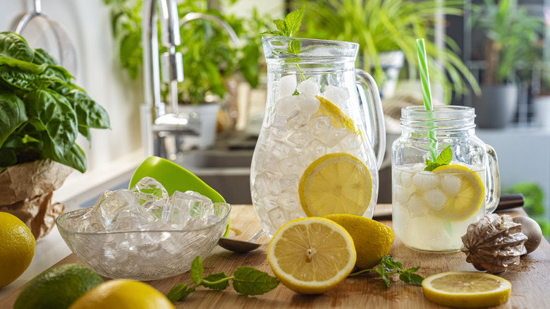 Lemons and lemonade in pitcher 