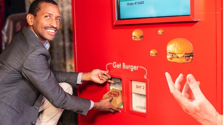Founder Audley Wilson using a RoboBurger machine