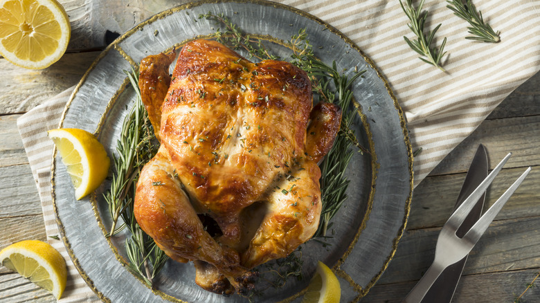 Homemade rotisserie chicken with herbs and lemon