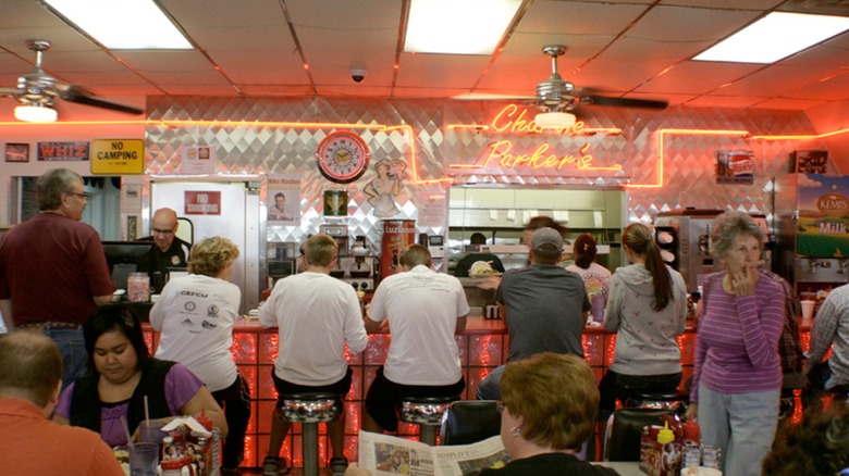 The interior of Charlie Parker's, lot's of customers and people sitting at the counter