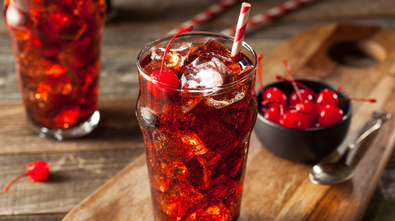 Roy Rogers mocktail on ice with cola, maraschino cherry