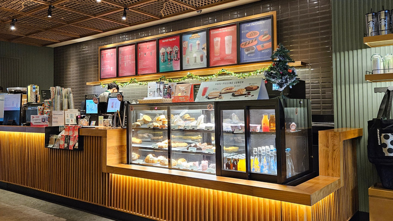 Starbucks storefront counter and menu.