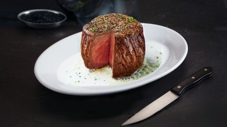 Small, thick, and round Ruth's Chris Steak House steak on a white plate