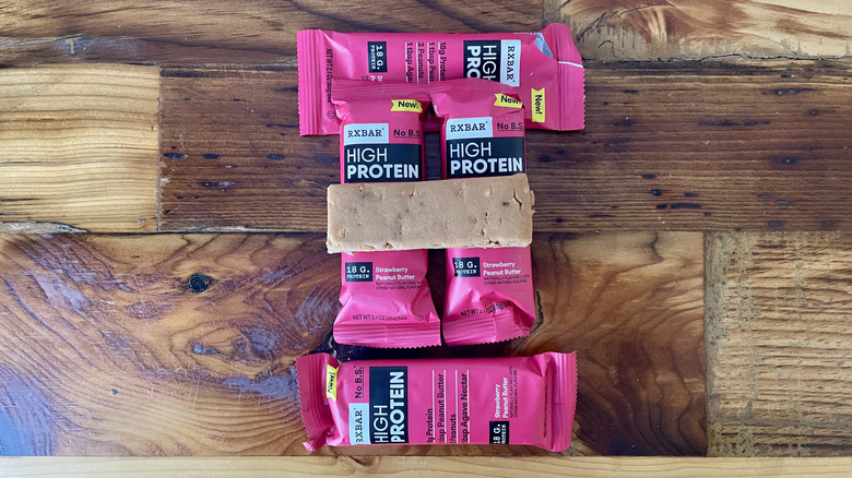 RX Bar High Protein Strawberry Peanut Butter protein bars on a wooden tabletop