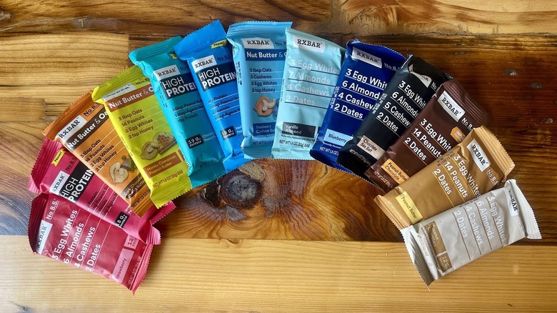 RX Bar's complete lineup of flavors fanned out on a wooden tabletop
