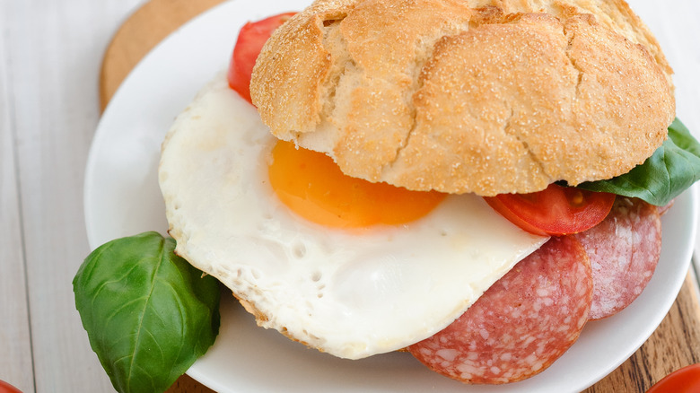 Salami and fried egg sandwich