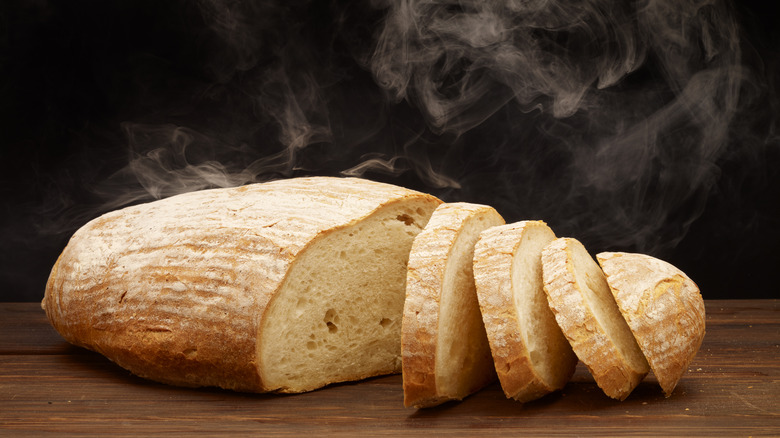 Warm slices bread loaf with steam rising out of it