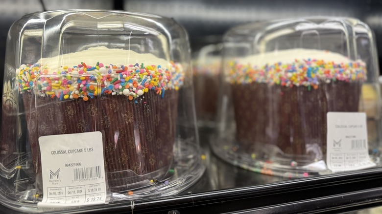 Giant cupcakes sit on a shelf in the bakery section of a Sam's Club